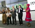 Seen at the JSE listing event: Jackie van Niekerk, CEO of Pivotal Fund Limited and Dave Savage, Executive Director of Pivotal, celebrating with entertainers after blowing the ceremonial kudu horn to mark the company’s listing.