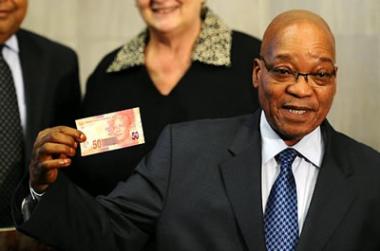 National symbol: President Jacob Zuma shows off the new 50 rand bank note with former president Nelson Mandela's image.